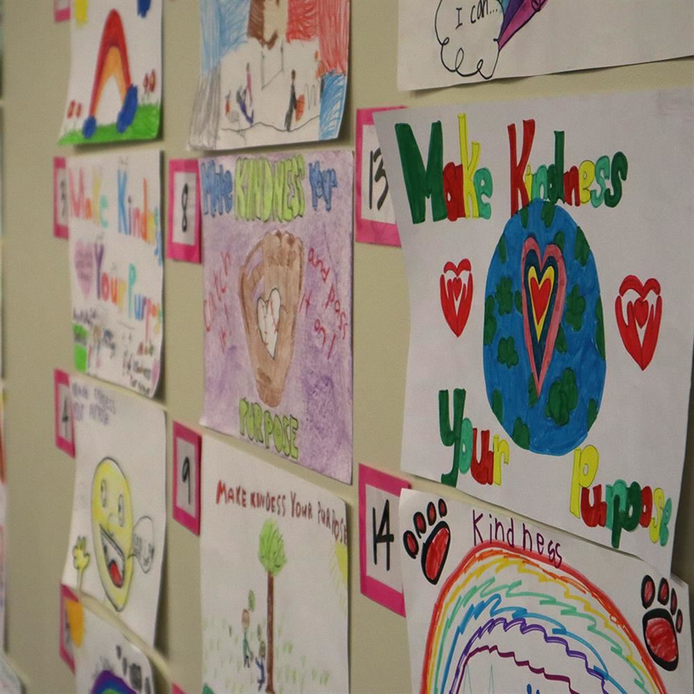 Kindness posters on display at the Educational Service Center for voting