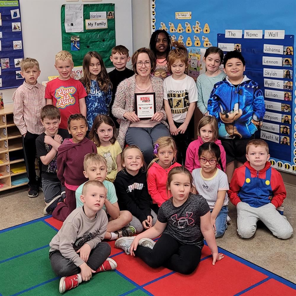 Kerri Deile pictured with her students after receiving her KS95 Teacher of the Week award