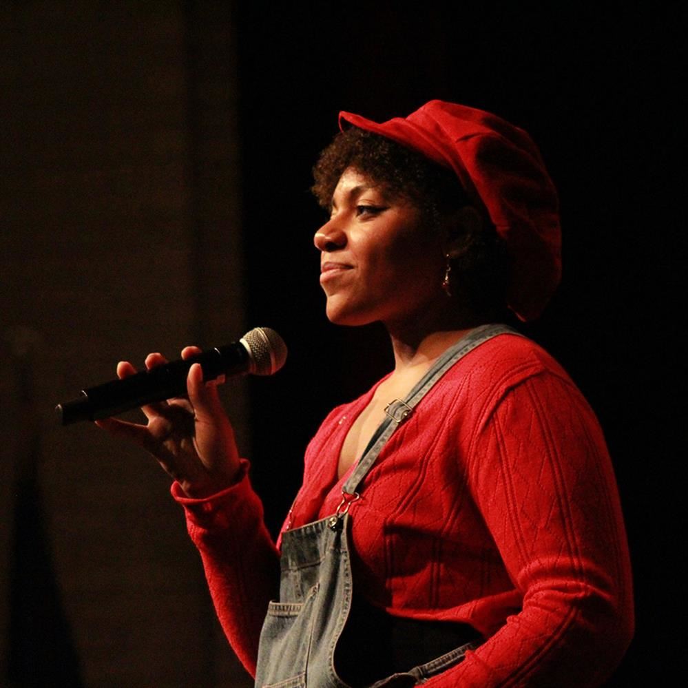 Imani Harris holding a microphone