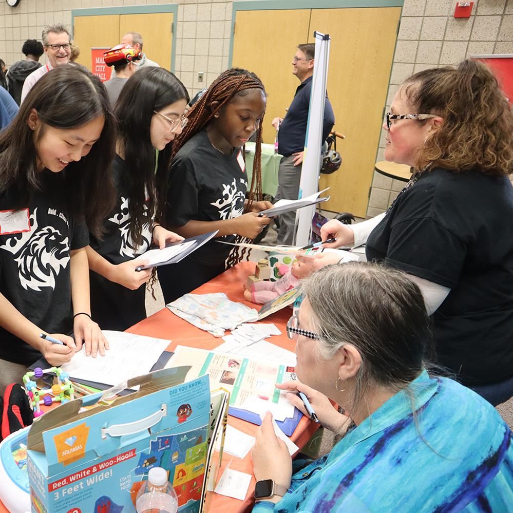 Students participating in financial simulation