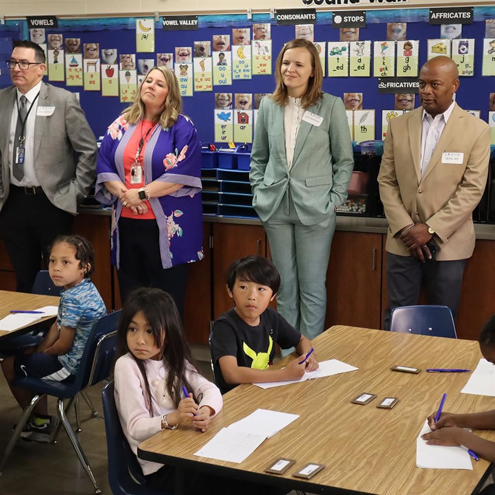 Education Commissioner Willie Jett and Superintendent Cory McIntyre and others visit classroom at Monroe