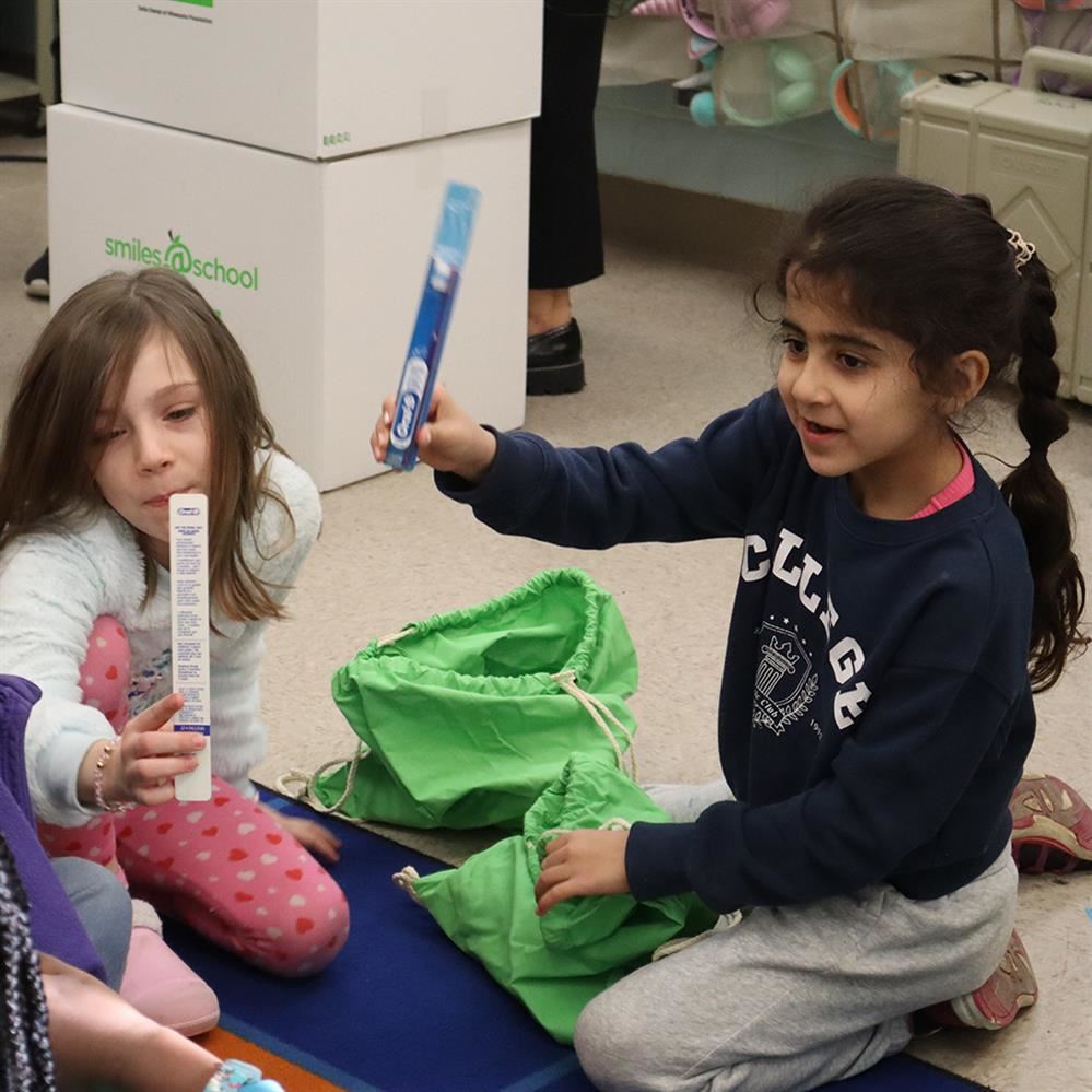 Adams Elementary students discover new toothbrushes in their dental health kits