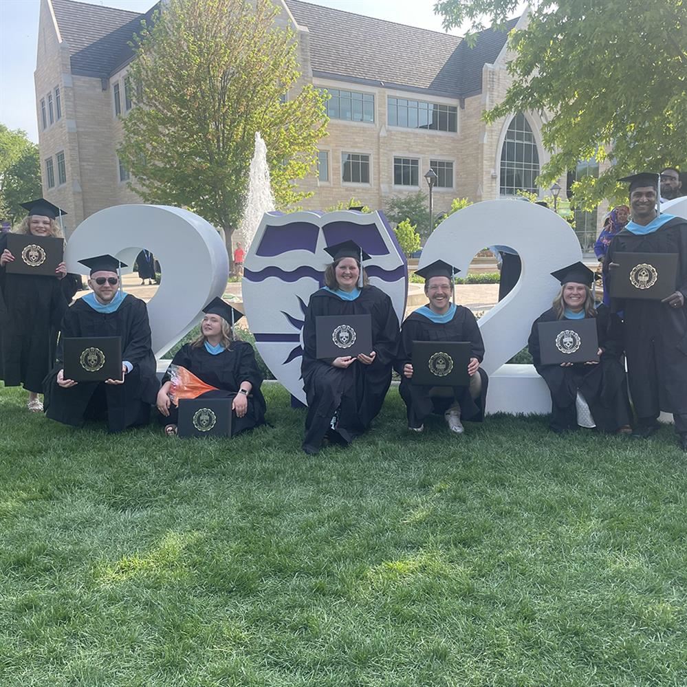  Some of Anoka-Hennepin's 16 graduates after graduating from the University of St. Thomas