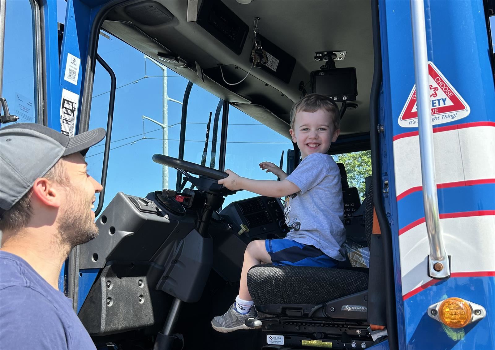 Child in big truck