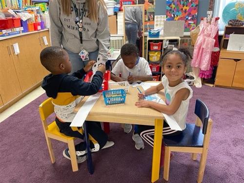 Preschool children sitting at a table