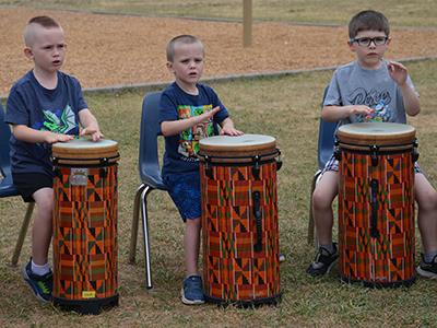students drumming