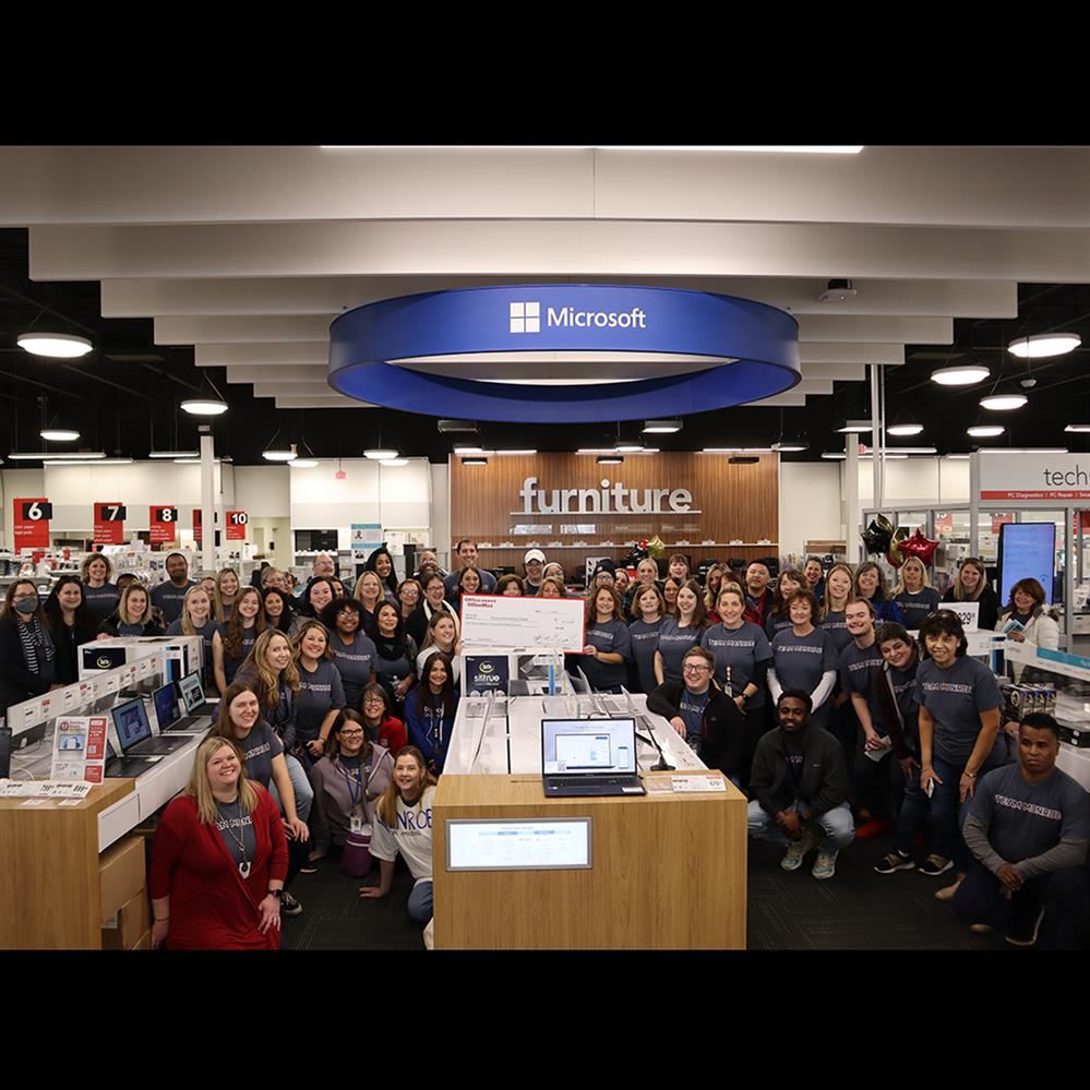   Monroe Elementary teachers and staff gather for a group picture at Office Depot