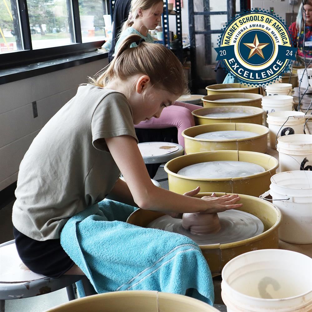  student on a pottery wheel 