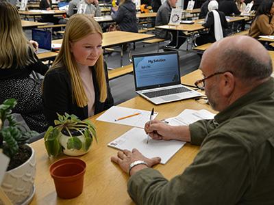 student working with a reviewer