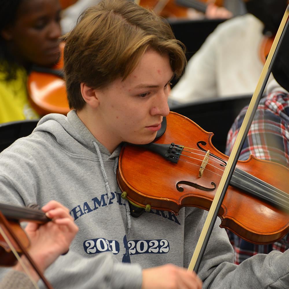 Andres Johnson playing the violin at rehearsal on Oct. 13 