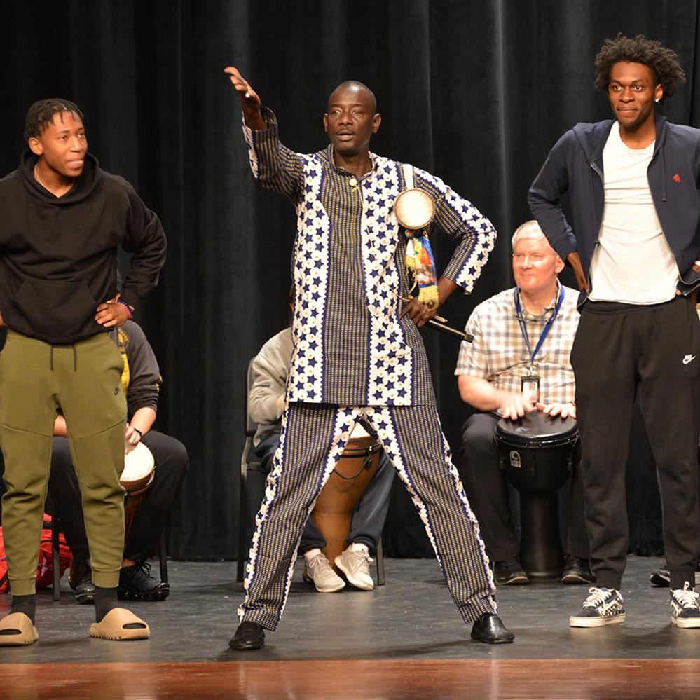  Massamba Diop performs with Champlin Park High School students