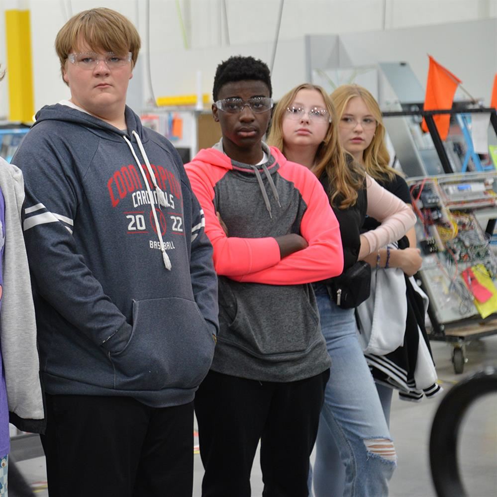  students listening to a tour guide