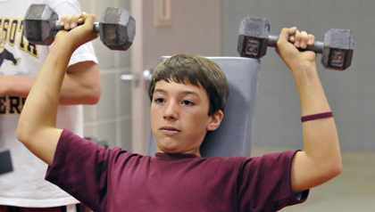 boy lifting weights 