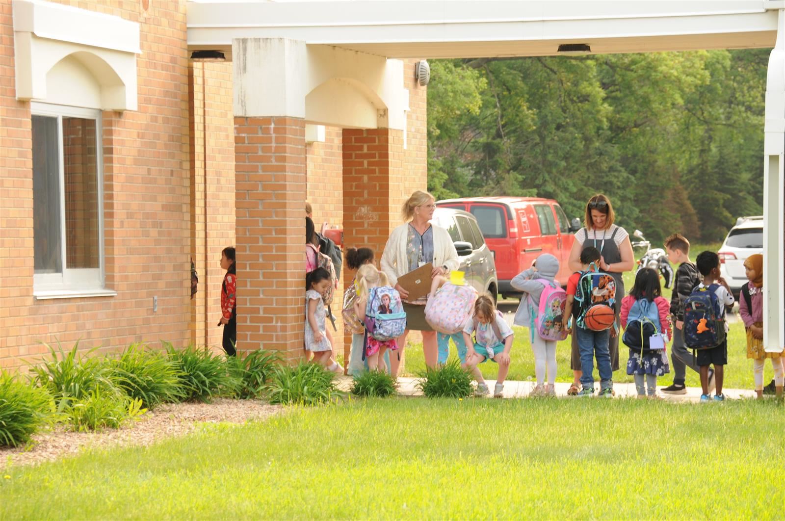  Children stand outside Adams Elementary School