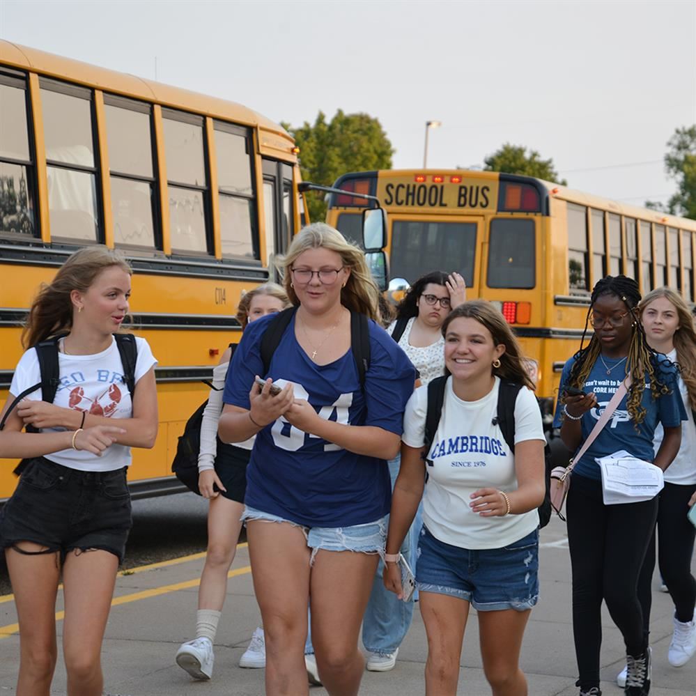  Students exit buses and enter the school at Champlin Park High School on Sept. 3