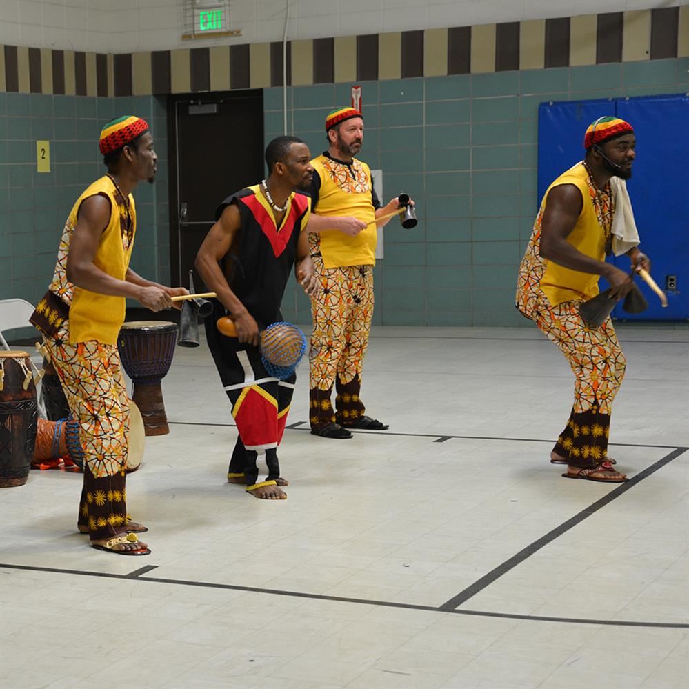  four members from the West African group with instruments 