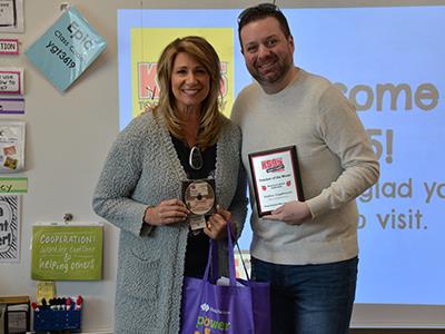 Pauline receives plaque from Hutch