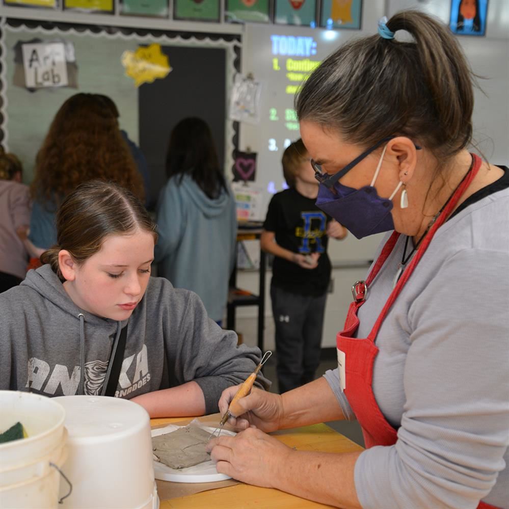  Coleman working with a student