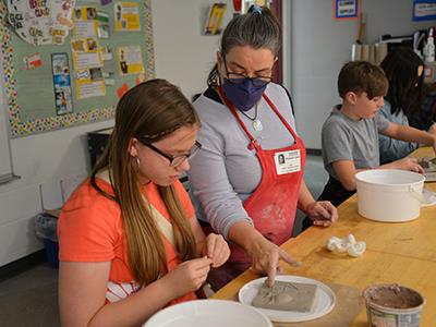 Coleman working with a student