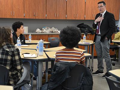 McIntyre talking with students