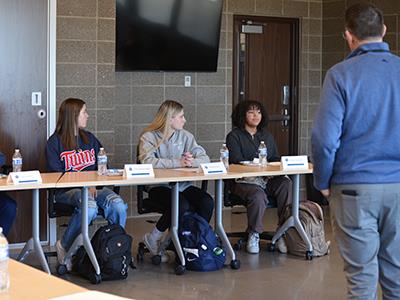 Superintendent McIntyre listening to students
