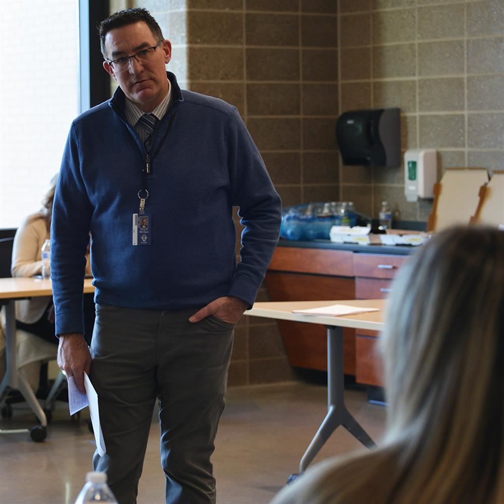  Superintendent McIntyre listening to a student 