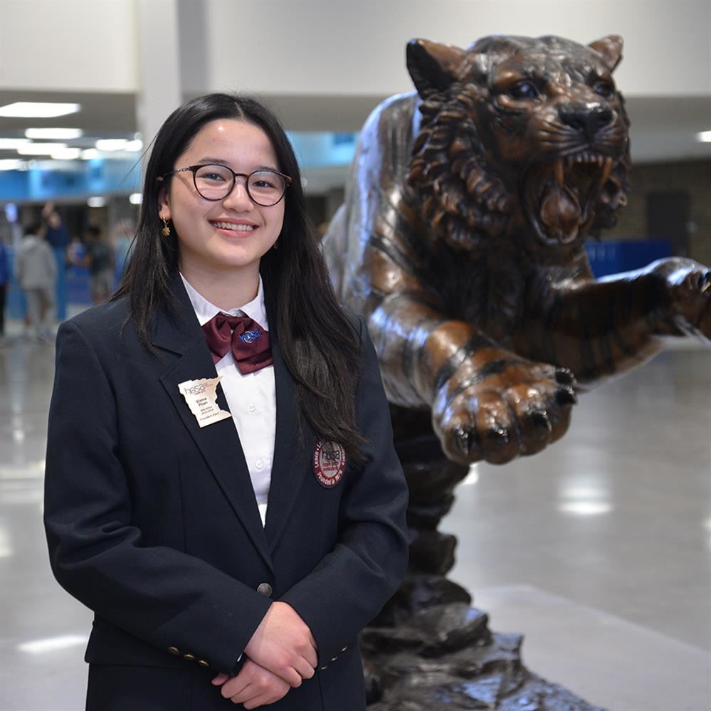  Phan posing for photo with Bengal statue in the background