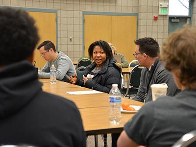 McIntyre listening to a student 