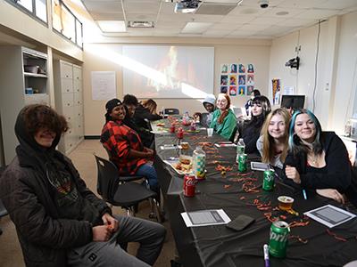 group of students at a long table