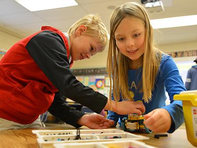 Nebula students working with LEGO kit
