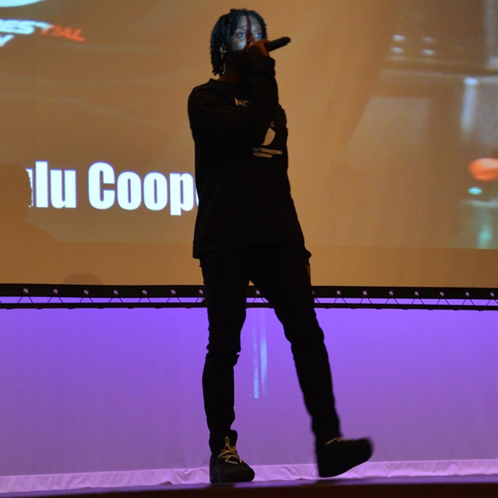  man with a microphone on stage
