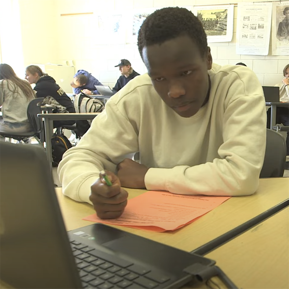  student looking at a computer 