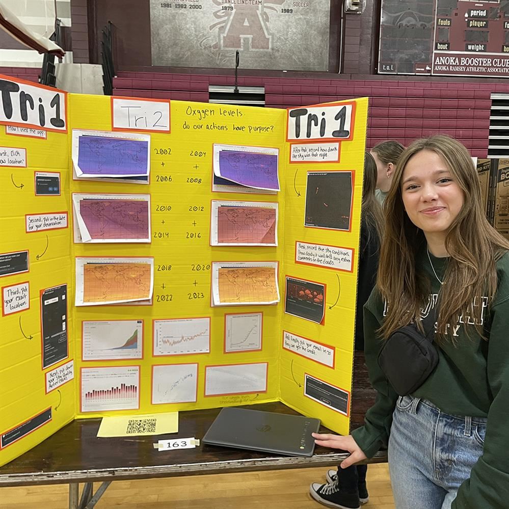  student posing with her project 