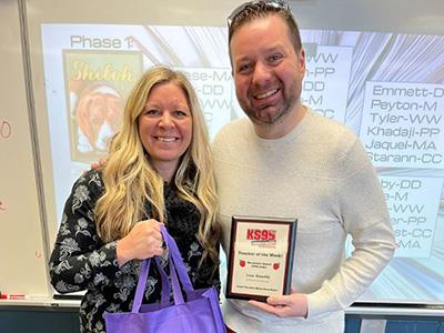 Lisa receiving plaque from KS95's Hutch