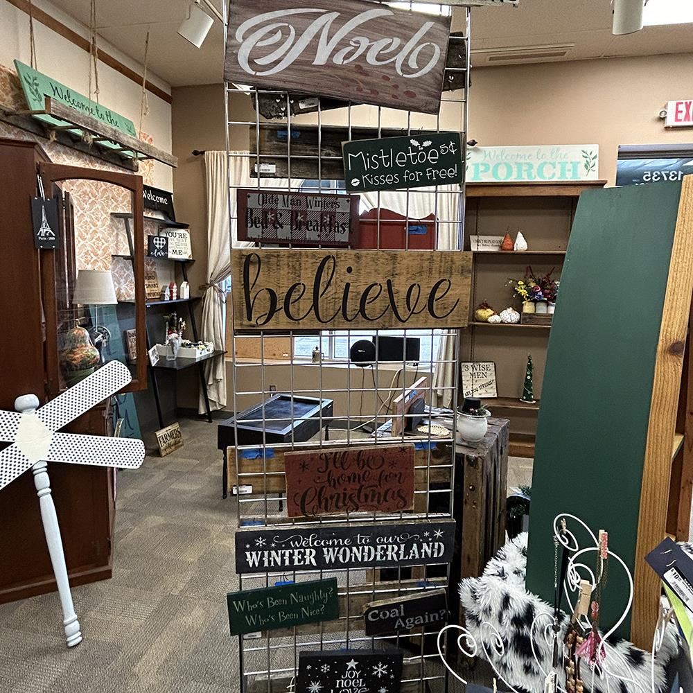 rack of wooden signs with sayings