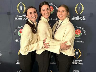Claire with princesses in front of Rose Bowl backdrop