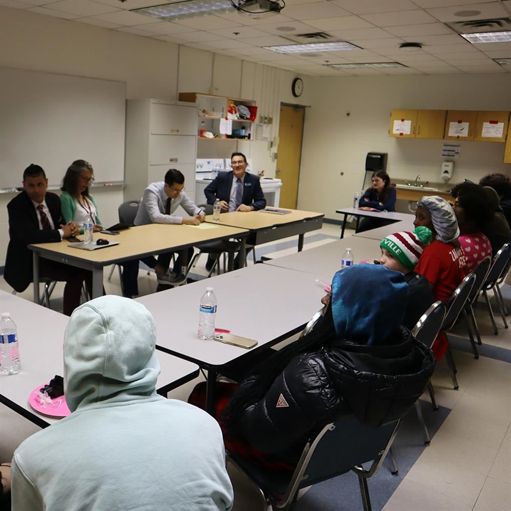  District administrators visit with students at the COMPASS program
