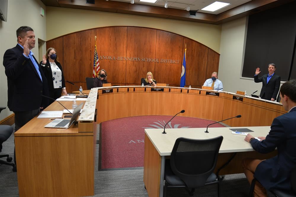 Board members taking the ceremonial oath at the Jan. 10 School Board meeting