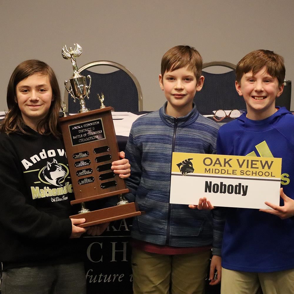  Conrad Kissel, Zachary Kuehn and Sawyer Lane holding the traveling trophy