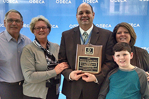 Blake Bodenburg pictured with his family upon receiving award 