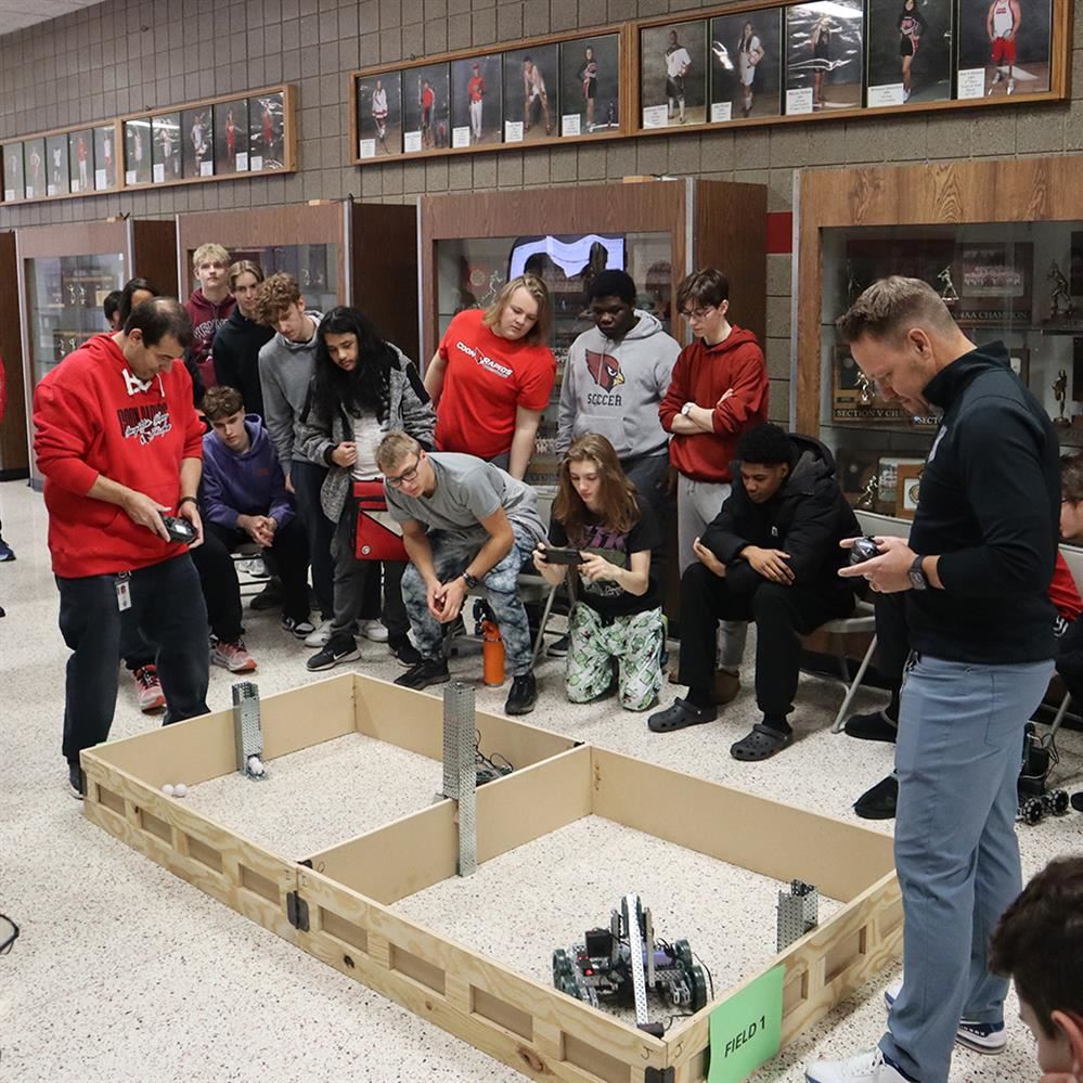  Students watch as Jason Paske and John Peña battle it out 