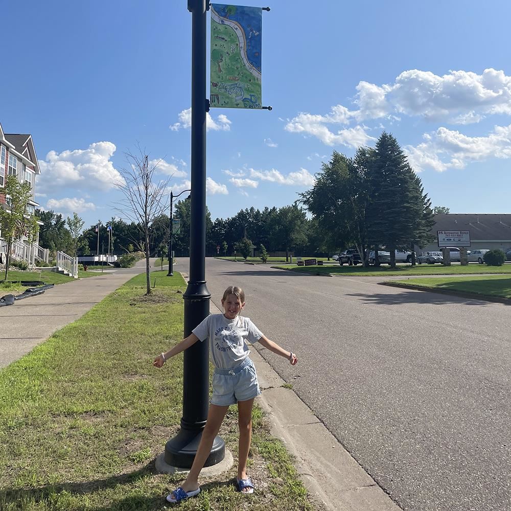 Cobi Larson and her 2nd-place winning banner displayed