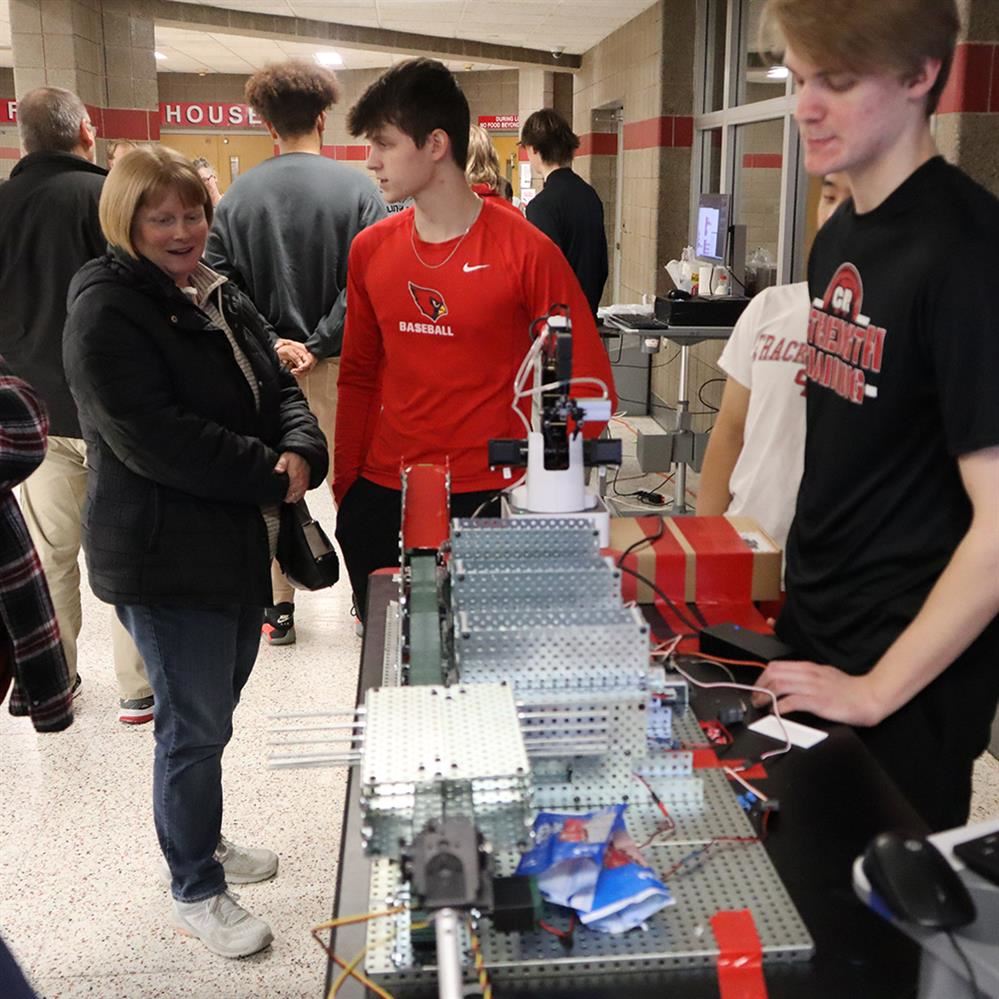  Students explaining their projects to event attendees