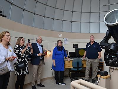 Jackson Middle School observatory coordinator Ron Schmit sharing information about the school's observatory with guests