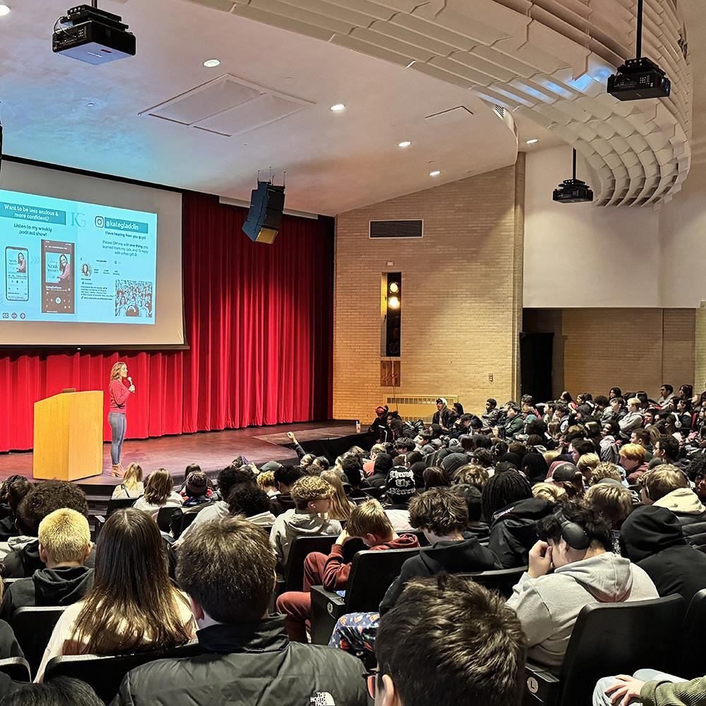  Kate Gladdin speaking to students at Coon Rapids High School
