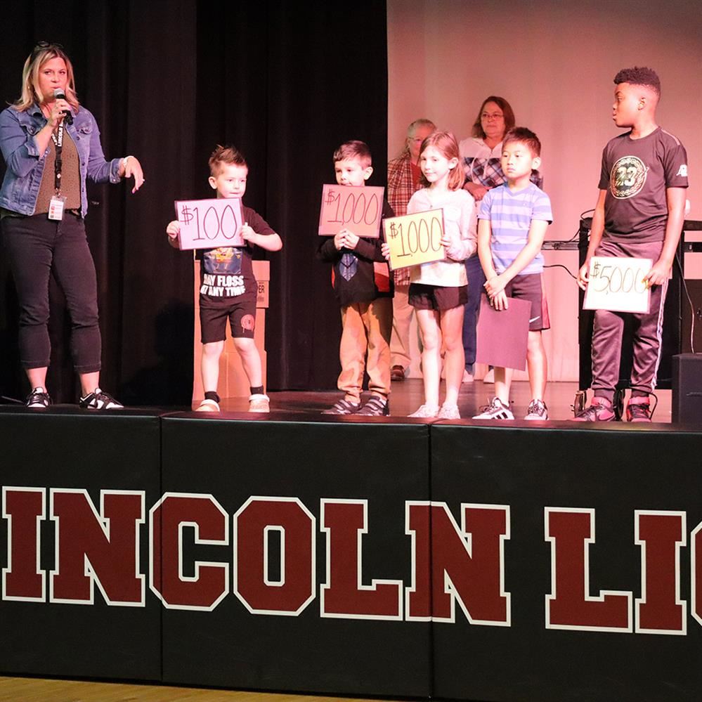  Students guess the amount of the donation at Lincoln Elementary school assembly