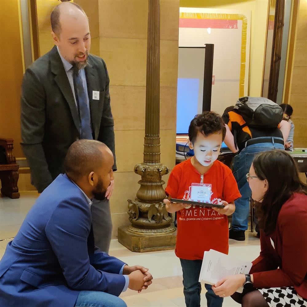  A Monroe Elementary School student explaining a project to lawmakers at the Capitol on Jan. 19