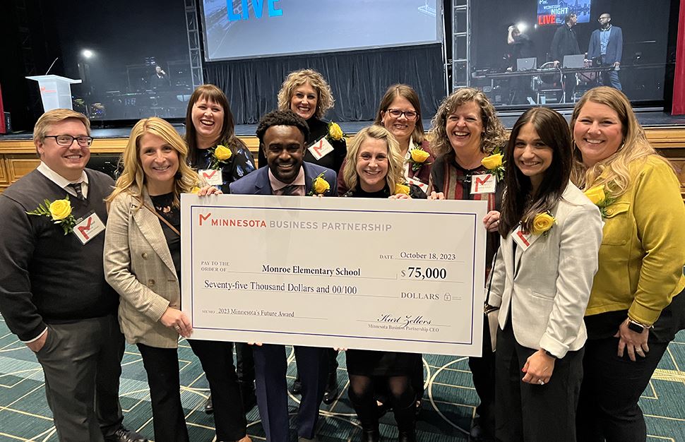 Monroe staff after receiving the Minnesota's Future Award from the Minnesota Business Partnership