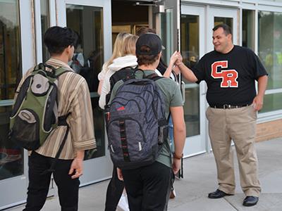 CRHS principal John Peña greets students on Sept. 7