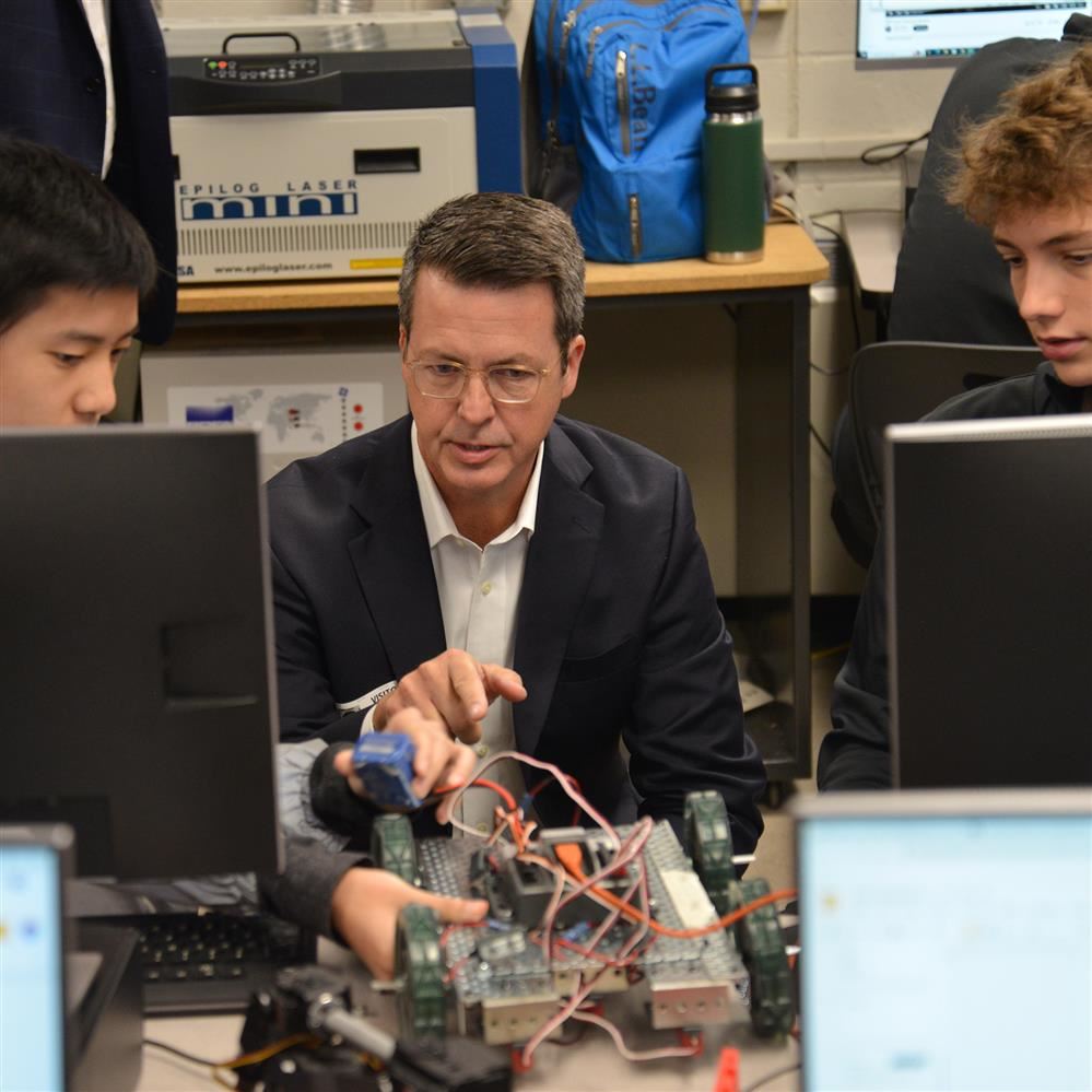  Project Lead the Way President and CEO David Dimmett visits with CRHS students